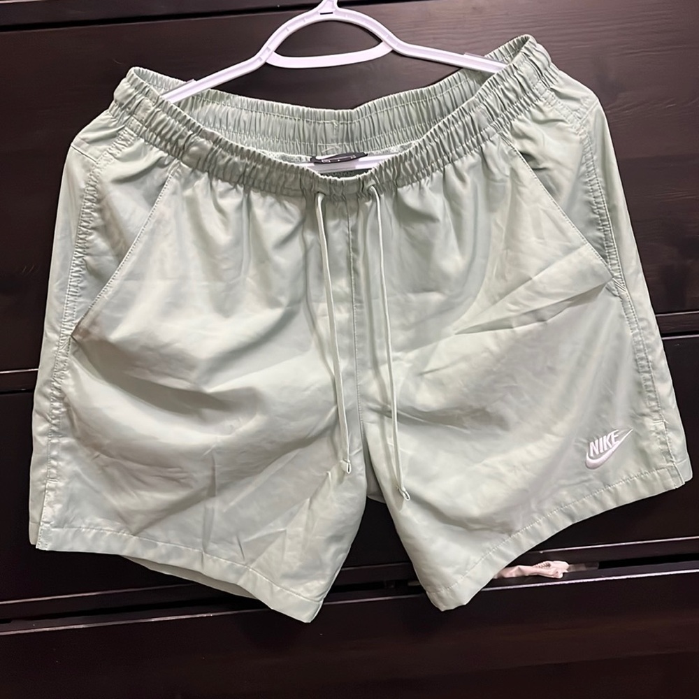 Nike Essential
Men's 7" Volley Swim Shorts color sage very light green.